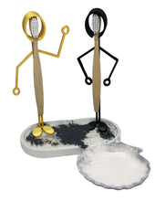 Load the image in the gallery,Support pour brosse à dents doré et noir avec support en pierre reconstituée et coupelle porte savon.