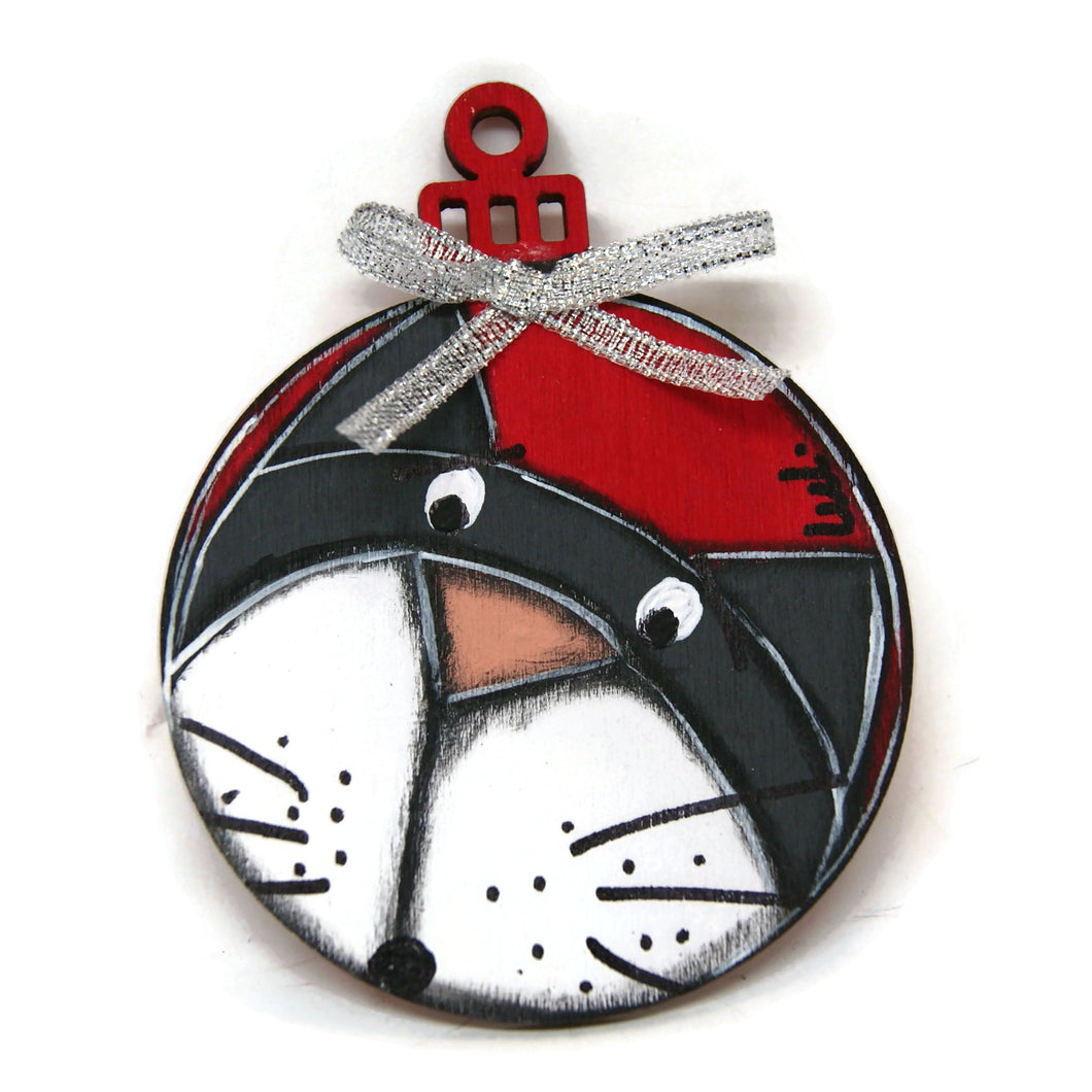 Painted wooden ornament in the shape of a Christmas ball with cat and ribbon for hanging in the Christmas tree